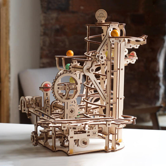 https://www.hearthsong.com/cdn/shop/files/099-UGears-Mechanical-Model-Marble-Run-Spiral-Hoist_7_WHR.jpg?v=1683055961&width=533